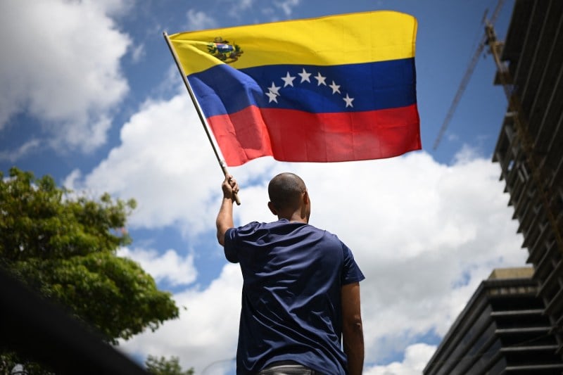 A man waves a Venezuelan flag during a protest in Caracas on Aug. 17.