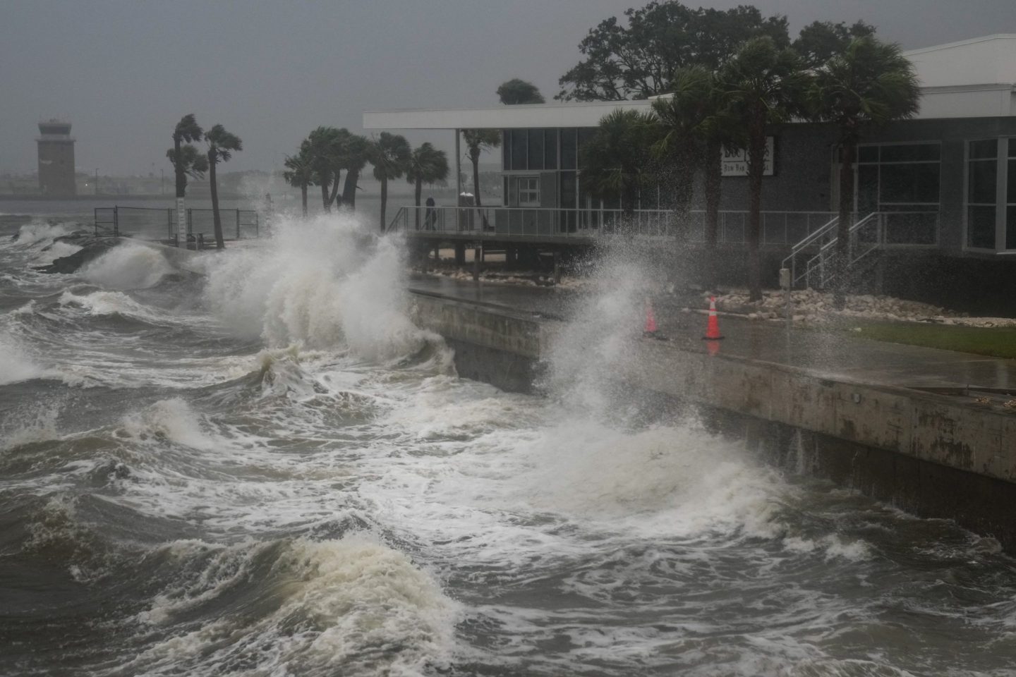 TOPSHOT &#8211; Waves crash along St. Pete Pier in St. Petersburg, Florida, as Hurricane Milton is expected to make landfall tonight on October 9, 2024. Milton regained power on October 8 to become a Category 5 storm with maximum sustained winds of 165 mph (270 kph) as it barrels towards the west-central coast of Florida and is forecast to make landfall late October 9, according to the National Hurricane Center. (Photo by Bryan R. SMITH / AFP) (Photo by BRYAN R. SMITH/AFP via Getty Images)