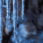 Icicles Hanging from Rock