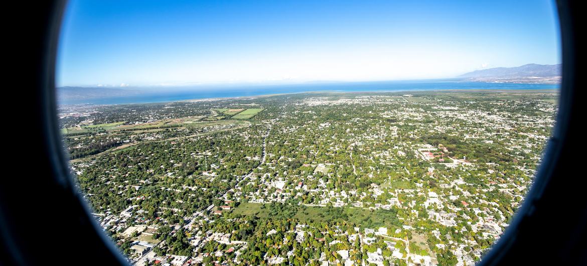 A helicopter flies over Haiti.