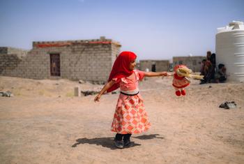 A girl plays in Al-Jufaina camp for displaced people in Marib, Yemen.