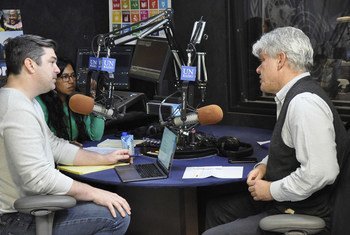 Fabrizio Hochschild, Special Adviser on Preparations for Seventy-Fifth United Nations Anniversary, in the UN News Studio at UN Headquarters in New York, with the UNcomplicated hosts, Sinduja Srinivasan and Jason DeWall.