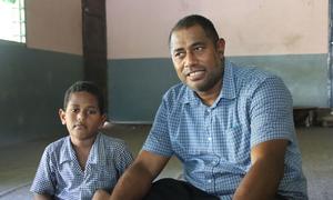 Orisi (right) and his 5-year old son, Semesa Francis Seniucidromo.