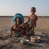  A young girl cooks in a rural village in Ethiopia, where the land has been affected by recurrent droughts.  