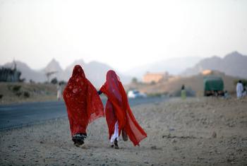 Two women walk along a road outside Keren, a city in the region of Anseba in Eritrea.