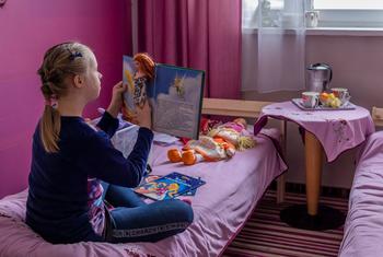 A young girl from Ukraine plays at her temporary home at the Kapelanka hostel in Poland. By the end of 2022, the number of school-aged refugees globally jumped nearly 50 per cent. 