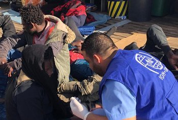 UN migration agency IOM aid workers offer help to migrants who have been returned to shore in Libya after attempting to cross the sea to Europe. (file)