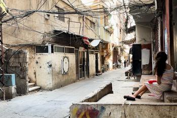 A girl sitting on the steps to her home in the Al Biddawi camp for Palestine refugees in northern Lebanon.