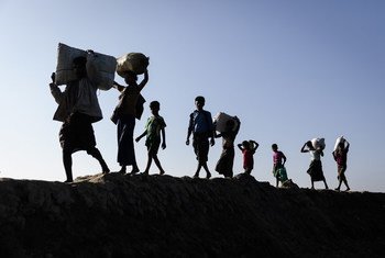 In this 2017 photograph, Rohingya refugees driven by brutal violence from their homes in Myanmar arrive in camps in Bangladesh.