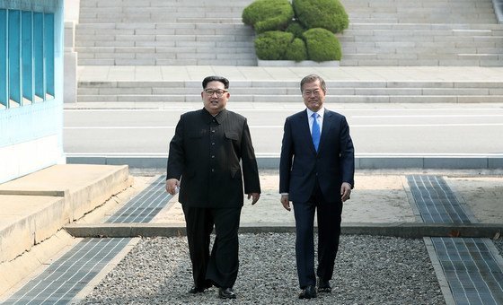 President Moon Jae-in (right) of the Republic of Korea greets Chairman of the State Affairs Commission Kim Jong-Un of the DPRK in Panmunjeom, during the April 2018 inter-Korean summit. 
