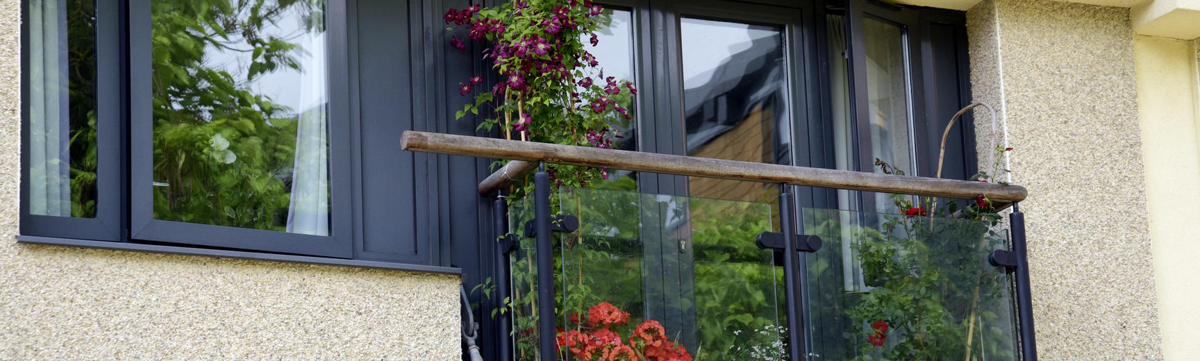 Image of a balcony with flowers and plants