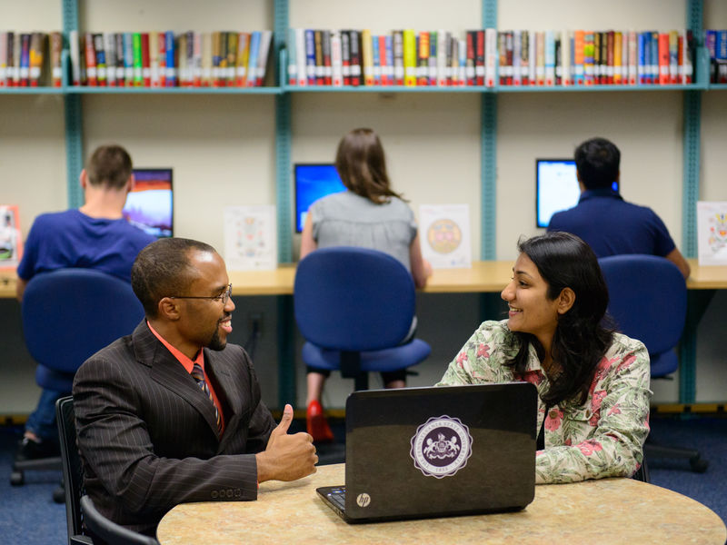 Student meeting with an academic program manager