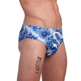 The Skull & Bones Bandana Swim Brief features a beautiful bandana-like indigo and white print.