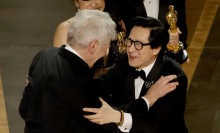 ke huy quan and harrison ford embracing onstage at the oscars