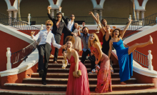 cast of 'Blink Twice' posing on staircase outside