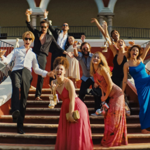 cast of 'Blink Twice' posing on staircase outside