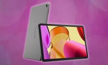 amazon fire max 11 tablet leaning on another tablet with its back facing forward against a dark pink background