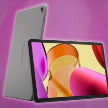 amazon fire max 11 tablet leaning on another tablet with its back facing forward against a dark pink background