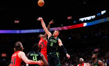  Kristaps Porzingis #8 of the Boston Celtics and Jamal Shead #23 of the Toronto Raptors leap for a jump ball during second half of their NBA game at Scotiabank Arena on January 15, 2025 in Toronto, Canada. 