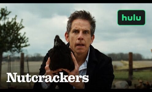 Ben Stiller holds a chicken.