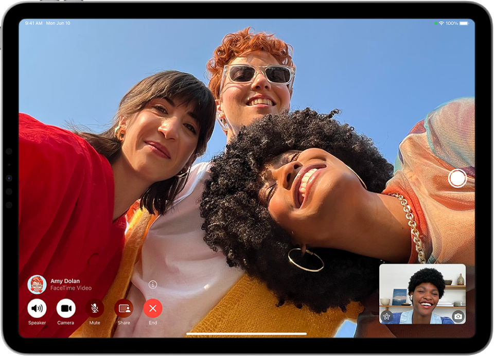 A Group FaceTime call with four participants. The caller’s image appears in a small rectangle at the bottom right.