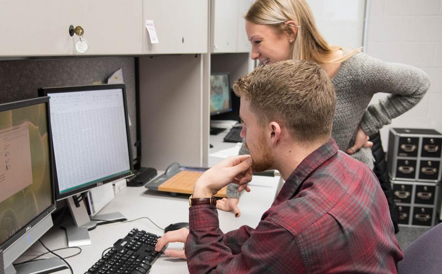 Researchers reviewing clinical data.