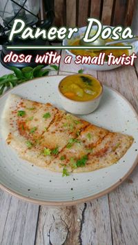 15min · 1 serving     Paneer Dosa Recipe  Ingredients:  Dosa Batter  • 1 tbsp - Tomato ketchup  • 1 tbsp - Pizza Sauce  • 1 tbsp - Schezwan Chutney  • Paneer, as needed  • Onion, as needed, chopped  • Coriander leaves, chopped  • Mozzarella cheese, as needed  • Vegetable oil, as needed  Method  In a bowl tomato ketchup, pizza sauce, and Schezwan chutney. Mix well and set aside.  • Heat a cast iron pan or a flat non-stick pan. (the pan should be medium hot)  • Pour a ladle full of batter and spread the dosas as thin as possible in a circular way.  • Drizzle some oil.(cook on a medium flame)  • Cook until the base becomes golden and crisp.  • When you see the base has become golden, spread some mixed chutney and then add grated paneer.  • Now add some chopped onion, coriander leaves, and som