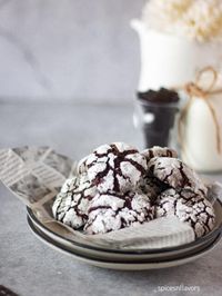 Eggless Crinkle Cookies stuffed with Nutella are the ultimate holiday treat—fudgy like a brownie, with a surprise Nutella center that melts in your mouth. Perfectly chewy, irresistibly chocolatey, and dusted with snowy sugar, they’re everything you need for a cozy baking day! My Failed Attempts Baking the eggless version of the most popular crinkle cookie... The post Fudgy Eggless Crinkle Cookies recipe appeared first on Spices N Flavors.