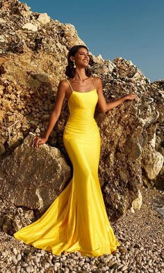 Long fitted open back formal dress with ruched back detail and scoop neckline. Elegant Yellow Dress, Open Back Formal Dress, Mermaid Prom Gown, Yellow Prom Dress, Mermaid Gown Prom, Yellow Prom, Empire Silhouette, Prom Dresses Yellow, Tuxedo Dress