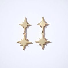 Fine Essentials - Double star dangle earrings | Sleepy Mountain Gold Earrings With Star Charm, Gold Sterling Silver Earrings With Star Charm, Gold Star Earrings Tarnish Resistant, Gold Star-shaped Tarnish Resistant Earrings, Star-shaped 14k Gold-filled Earrings, Gold Star Charm Earrings In 14k Gold, 14k Gold-filled Star Earrings, Gold Earrings With Star Charm In 14k Gold, Gold Star-shaped Celestial Earrings