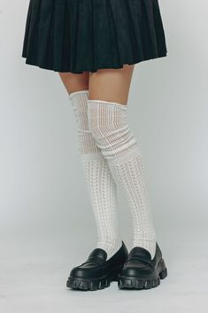 You'll love the amazing crochet pattern and the adorable scrunched look in these unique stockings. Pair this with boots for an outfit that's feminine, soft, and irresistible. Fitted Thigh High Knitted Legwear, Fitted Thigh-high Knitted Legwear, Soft Knee-high Stockings, Thigh High Cable Knit Socks For Stocking Stuffer, Fitted Knitted Knee-high Legwear, Thigh-high Cable Knit Socks For Stocking Stuffers, Thigh High Cable Knit Socks, One Size Cable Knit Socks, Trendy Knitted Socks For Spring