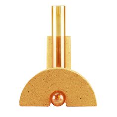 a gold colored object with a ball on it's end and two poles in the middle