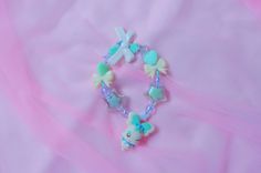 Let everyone see just how magical you are with the cutest coordinate you can dream of!  This is a handmade Heartcatch Precure inspired charm bracelet using an authentic Coffret charm straight from Japan! While this is a new bracelet using new beads and cord, the charm itself is second hand. Please buy knowing there may be some scuffs, chips, and general aging on the charm itself. However, all charms have been disinfected and cleaned to the best of my ability and are happy to serve a new life on Adjustable Jewelry With Cute Design Gift, Kawaii Bracelet Jewelry For Friendship, Kawaii Friendship Bracelet Jewelry, Cute Blue Charm Bracelet For Friendship, Cute Charm Bracelets For Friendship, Handmade Blue Kawaii Jewelry, Cute Blue Charm Bracelet For Gift, Handmade Kawaii Jewelry For Friendship, Cute Beaded Bracelets With Charms For Gift