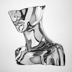 black and white photograph of an abstract glass sculpture in the shape of a woman's head