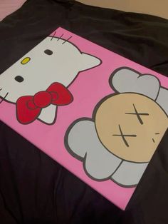 an image of a hello kitty painting on a canvas that looks like it has been painted