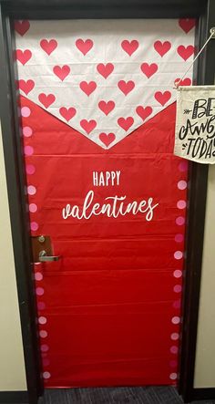 a valentine's day door decorated with red and white hearts