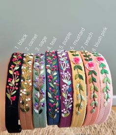 ● This hand-embroidered hairband features beautiful floral patterns and vibrant colours.  ● Made from soft, durable herringbone ribbon, it offers a comfortable fit for all head sizes.  ● Hairbands with teeth hold your hair well, so they don't slip off easily.  ● The embroidery on the headband is mainly in the center, covering about 12 cm, while both ends have no embroidery. ● Perfect for any occasion, it combines traditional craftsmanship with vintage style. ● There are two sizes available. The Hand Embroidery Hair Bands, Embroidery Hair Band, Embroidered Hairband, Embroidery Hairband, Embroidery Headband, Hand Embroidery Letters, Embroidery Hair, Fabric Bangles, Hair Bands For Women