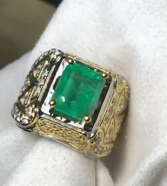 This stunning handmade ring features a genuine natural emerald, set in a delicate crown-inspired setting. The emerald is a beautiful 2.5 carats (approx), and the ring is made from high-quality 925 sterling silver. This ring is perfect for any occasion, and is sure to add a touch of elegance to your outfit. Perfect for: Special occasions: Anniversaries, birthdays, weddings, or graduations Everyday wear: Add a touch of class to your daily attire Gift-giving: A thoughtful and meaningful present for a loved one Please note that shipping times may vary depending on your location and the carrier used. Orders typically take 3 business days to process before shipping. Once shipped, you will receive a tracking number so you can monitor the progress of your delivery. Please allow additional time for Vvs Clarity Diamond Ring With Rectangular Stone, Exquisite Emerald Cut Rings For Gift, Exquisite Emerald Cut Rings As Gifts, Dazzling Green Diamond-cut Rings, Dazzling Green Diamond Cut Ring, Octagon Emerald Ring With Diamond Accent Stones, Rectangular Emerald Ring Gift, Dazzling Emerald Ring With Prong Setting As Gift, Dazzling Emerald Ring With Prong Setting