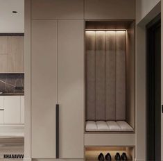 a modern kitchen with white cabinets and marble counter tops is shown in this image, there are shoes on the floor