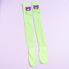 Look absolutely cute while keeping your feet and legs warm by wearing these neon green long socks! These are decorated with Gurumi patches and safety pins. The unique bear character from Gloomy Bear is created by the well-known Japanese artist, Mori Chack. Made from soft polyester material Length: 75 cm One size fits most (women’s ): 22-24 cm / US 5-8 / EU 35-38.5 Cute Green Socks For Stocking Stuffers, Acdc Rag, Loose Socks, Silly Clothes, Gloomy Bear, Yume Kawaii, Kawaii Backpack, Anime Makeup, Bear Character