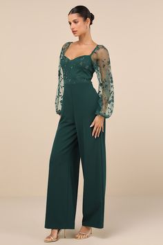 You'll strut your way into everyone's heart in the Lulus Darling Charisma Emerald Mesh Embroidered Jumpsuit! Elegant floral-embroidered mesh shapes a sweetheart neckline (with hidden no-slip strips) and long, sheer balloon sleeves (with elasticized shoulders and cuffs) that can be styled on or off the shoulders. The high, fitted waist tops crepe knit pants with a wide-leg silhouette and full-length hems. Hidden back zipper/clasp. Fit: This garment fits true to size. Length: Floor length. Size me Forest Green Jumpsuit Wedding, Bridesmaid Pantsuit, Jumpsuits For Women Formal, Formal Wedding Guest Attire, Jumpsuit Wedding Guest, Green Outfits For Women, Fancy Jumpsuit, Bride Jumpsuit, Formal Wedding Attire