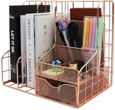 a metal desk organizer with books, pens and pencils