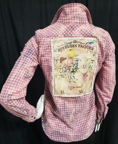 I made this reimagined shirt shacket from a gently used butter soft women's plaid flannel in shades of pinks & purples. It was bleach-dyed before adding a fun French country style sublimated backpatch depicting a sweet baby lamb & duck.  Perfect for spring and Easter. Pink Flannel Shirt, Flannel Upcycle, Reworked Flannel, Flannel Shirt Refashion, Bleached Flannel Shirt, Baby Lamb, Bleach Dye, Shirt Refashion, Plaid Flannel