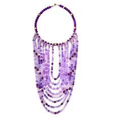 The choker measures 16 IN, and the longest strand of beads measures 30 IN.   The necklace design displays dangling glass beads in shades of purple with brass accent beads—the beads lay in the front of the chest without moving out of place. Purple Beaded Chain Necklace With Round Beads, Purple Large Beaded Necklace, Purple Necklaces With Dangling Round Beads, Adjustable Purple Beaded Necklace With Dangling Beads, Adjustable Purple Necklace With Dangling Beads, Adjustable Purple Beaded Necklace With Large Beads, Adjustable Purple Necklaces With Dangling Beads, Adjustable Purple Beaded Necklaces With Large Beads, Purple Necklaces With Dangling Beads