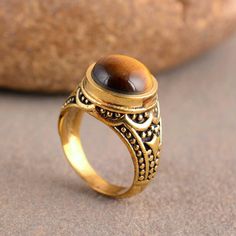 "Tiger Eye Ring, Handmade Ring, Wedding Ring, Tiger's Eye Ring, Gift For Her, Anniversary Ring, Promise Ring, Dainty Ring, Mothers Day Gift Size:- All Size Available In Variation Metal:- Silver Stone:- Tiger Eye Size:- All Size Available In Variation Metal:- Brass 1 product free gift on purchase of 3 products. You can choose the plain brass ring free gift as your wish. Take a screenshot of plain brass ring you like from my shop and send me a photo in personal message. MUST READ....👇 5 stars is Spiritual Round Promise Rings, Spiritual Round Rings For Anniversary, Handmade Brown Ring For Wedding, Brass Crystal Wedding Ring, Wedding Stackable Brass Rings, Wedding Brass Crystal Ring, Brown Round Rings For Anniversary, Antique Brown Wedding Rings, Brown Handmade Rings For Anniversary