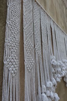 some tassels hanging on the side of a building