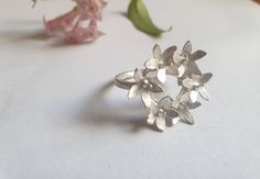 Flower ring, retro ring, floral ring, gold ring women, vintage style ring, handmade boho ring, bunch of flowers ring, vintage ring A romantic, vintage inspired silver ring retro and chic, made with 6 small silver flowers creating a crown on top of a delicate silver band. This bunch of flowers ring is available both in 14 karat gold plating or sterling silver The floral ring is handmade and delicate, and can be a beautiful gift for women. The ring is available in multiple sizes.  Other sizes are Delicate Flower Ring For Spring, Delicate Flower Shaped Ring For Spring, Flower-shaped Wedding Rings For Spring, Flower Shaped Wedding Rings For Spring, Spring Wedding Rings With Flower Shape, Spring Wedding Rings In Flower Shape, Spring Wedding Flower Ring, Flower-shaped Promise Ring For Spring, Spring Flower Shaped Promise Ring