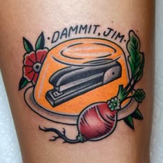 a tattoo with an image of a knife and radishes on it's thigh