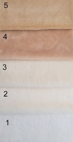 four different colors of towels with numbers on each one and the number five in white