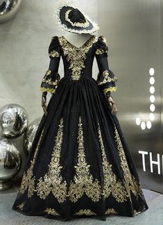 a black and gold dress is on display